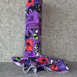 Muss Busters reusable towel in Disney Villains print laid flat showing full pattern