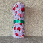 Muss Busters reusable towel roll in periwinkle strawberry print with green ribbon