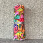 Muss Busters reusable towel roll in psychedelic dinosaur print alternate angle